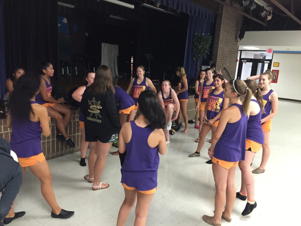 The Sabrettes gather around for team instructions at the practice before their next parade