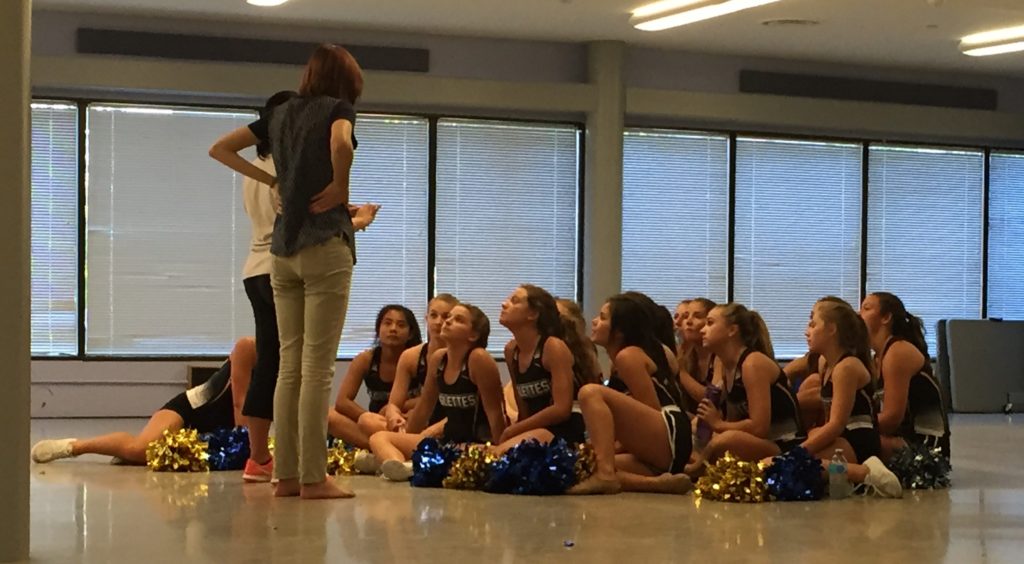 Something super important is being said by Sandburg's coaches to their Eaglettes