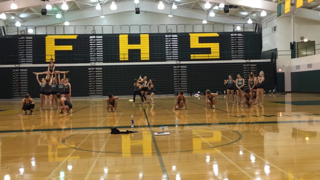 The Fremd Poms never pass on a chance to stick a lift into a halftime dance